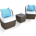 Two Rattan Single Sofas With White Cushions Blue Pillows And Small Coffee Table