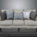Cream Fabric Sofa With Rolled Arms Dark Wooden Legs And Gray Light Blue Throw Pillows