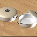Stainless Steel Cooking Pots With Open And Closed Lids On Wooden Tabletop