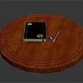 Round Red Wooden Table Top With Black Notebook Pen And USB Drive