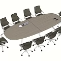 Oval Light Wood Conference Table With Black Swivel Office Chairs In Meeting Room