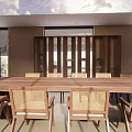 Serene Lounge Area Featuring Long Wooden Table Rattan Chairs And Large Windows With Natural Light