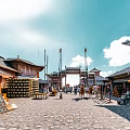 Traditional Style Swing Doors In Ancient Street With Stone Pavement And Classic Architecture