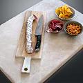 Marble Countertop With Wooden Board Salami Chef Knife Bowls Of Chips Red Veggies And Nuts