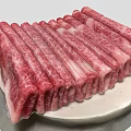 Fresh Sliced Marbled Beef Arranged On White Plate For Serving