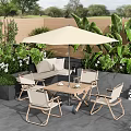 Garden Outdoor Relaxation Space With Patio Furniture Umbrella And Lush Green Plants