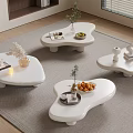 Modern White Coffee Tables On Grey Rug With Vases Fruits Books And Decor