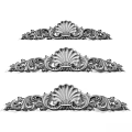 Artistic Dark Wood Carvings Showcasing Intricate Shell Shapes And Scrollwork Patterns