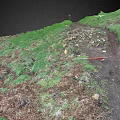 Green Hillside Scenery with Dirt Path Stones and Red Object Under Dark Sky
