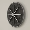 Round Black Wall Decor With Radial Lines And Minimalist Metal Frame