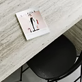 Modern Apartment Interior With Marble Table Black Chair And Magazine