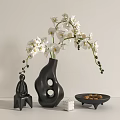 Black Irregular Shaped Vase with White Orchids and Decorative Items in Minimalist Modern Light Background