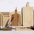Various Wooden Cutting Boards With Chef Knife Garlic And Fresh Ingredients On Kitchen Counter
