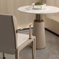 Modern Minimalist Interior With Round Table And White Chairs Set Stone Wall And Green Plant