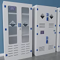 Four White Storage Cabinets With Glass Doors And Blue Accents Against Blue Wall