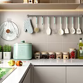 Hanging Kitchen Utensil Set with Spatulas Spoons Oven Mitts and Spice Jars in Modern Kitchen
