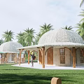 Round Wooden Huts With Thatched Roofs Palm Trees And Green Umbrellas In Outdoor Area