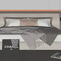 Modern Double Bed with Plush Pillows Fringe Blanket and Chanel Tote on Striped Rug