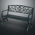 Green Metal Outdoor Bench Featuring Ornate Scrollwork Backrest and Classic Design