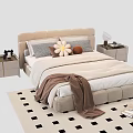 Double Bed With Beige Headboard Flower Shaped Pillows Brown Blanket Nightstands And Checkered Rug
