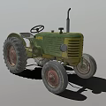 Vintage Green And Yellow Tractor With Large Wheels Steering Wheel And Exhaust Pipe