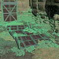 Rustic Stone Walls With Wooden Door And Metal Grating On Gravel Ground