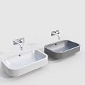 Two Modern White and Gray Washbasins with Silver Faucets in Minimalist Design