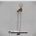 Hand Shaped Wooden Wall Lamp With Transparent Glass Bulb And Filament On White Wall