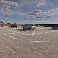 Parking Lot With White Car Yellow Lines Parking Sign And Brick Walls