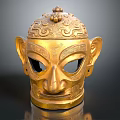 Intricate Golden Mask Sculpture With Detailed Carving Patterns And Decorative Top