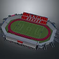 Football Stadium Featuring Red Stands Green Grass Pitch And Red Running Track