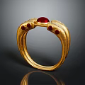 Elegant Gold Ring With Curved Design And Red Gemstone Embellishments For Fashion