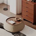 Round Coffee Table with Wooden Top Woven Texture holding Book and Nuts on Rug