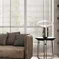 Modern Living Room Interior Design With Beige Sofa Round Coffee Table And Large Windows