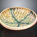 Hand Carved Ceramic Bowl With Green Yellow Patterns And Radial Texture Design 3d model