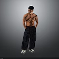 A Shirtless Muscular Man In Dark Cargo Pants And Black White Sneakers Against Grey Background