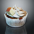 Delicious Cupcake With White Paper Liner Creamy Frosting Fresh Apple Slice And Cinnamon Sprinkles