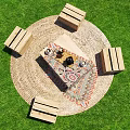 Wooden Crate Outdoor Chairs Around Fire Pit On Grassy Lawn With Tablecloth And Rug