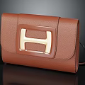 Brown Leather Clutch With Gold H Logo And Elegant Smooth Design