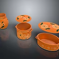 Handcrafted Orange Ceramic Containers With Green Leaf Patterns And Various Shapes 3d model