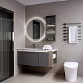 Modern Bathroom Vanity With Round Backlit Mirror Gray Cabinet And Rolled Towels