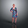 Woman in Colorful Floral Dress Standing with One Hand on Hip Against Gray Background