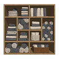 Neatly Arranged Gray And White Towels In Wooden Compartments With Folded And Rolled Styles