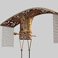 Golden Intricate Carved Hat With Curved Top And Hanging Colorful Tassels
