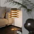 Modern Gold Layered Shade Floor Lamp In Cozy Living Room With Sofa And Plant