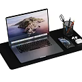 Modern Laptop Setup on Desk with Pen Holder Scissors Pens Phone Mouse and Mouse Pad