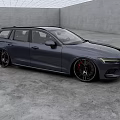Dark Blue Volvo Estate Car With Sleek Design And Black Alloy Wheels