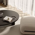 Black Round Coffee Table With Tray Book Glasses And White Decor Near Beige Sofa Chair