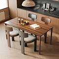 Modern Wooden Dining Table And Chairs Set With Fruits Candles And Books In Kitchen Area