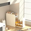 Modern White Kitchen Storage Cabinet With Bottles And Paper Towels Near Window